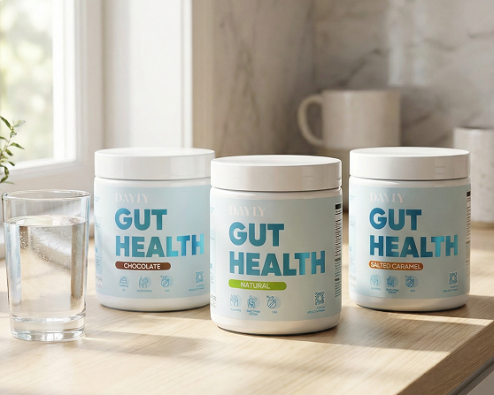 Four containers labeled 'Gut Health' on a kitchen counter with cups and water glasses in the background.