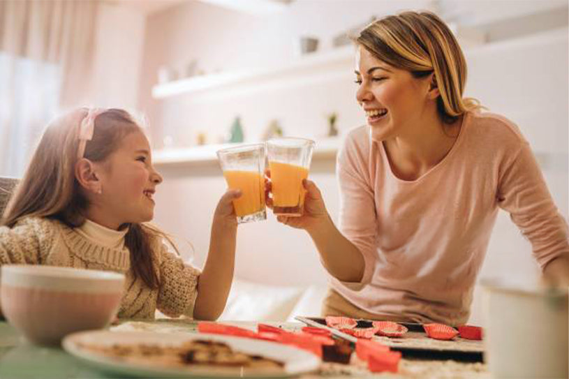 mum and daughter drinking DAYLY Gut Health and smiling