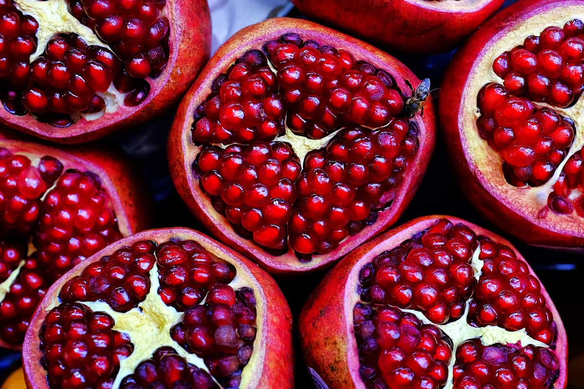 Pomegranates cut open showing seeds