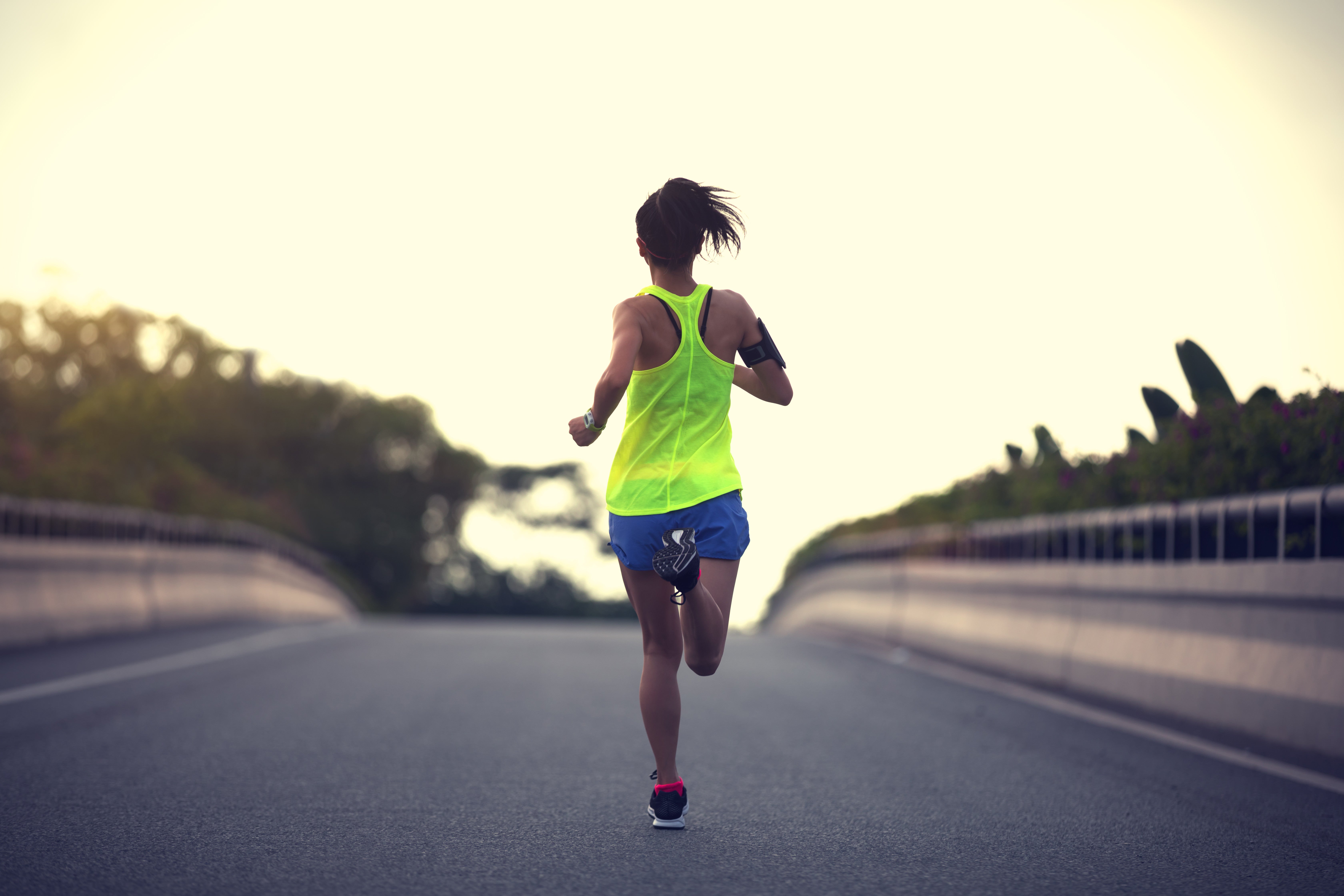 women going for run down the road