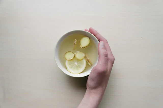 cup of lemon water on a table