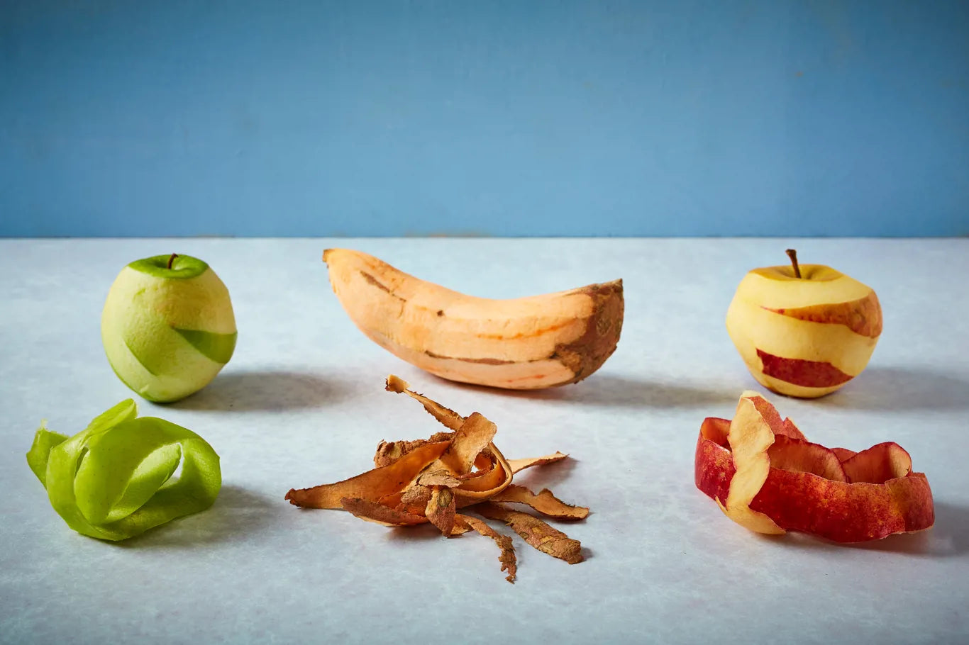 banana, sweet potato and apple with their peels off