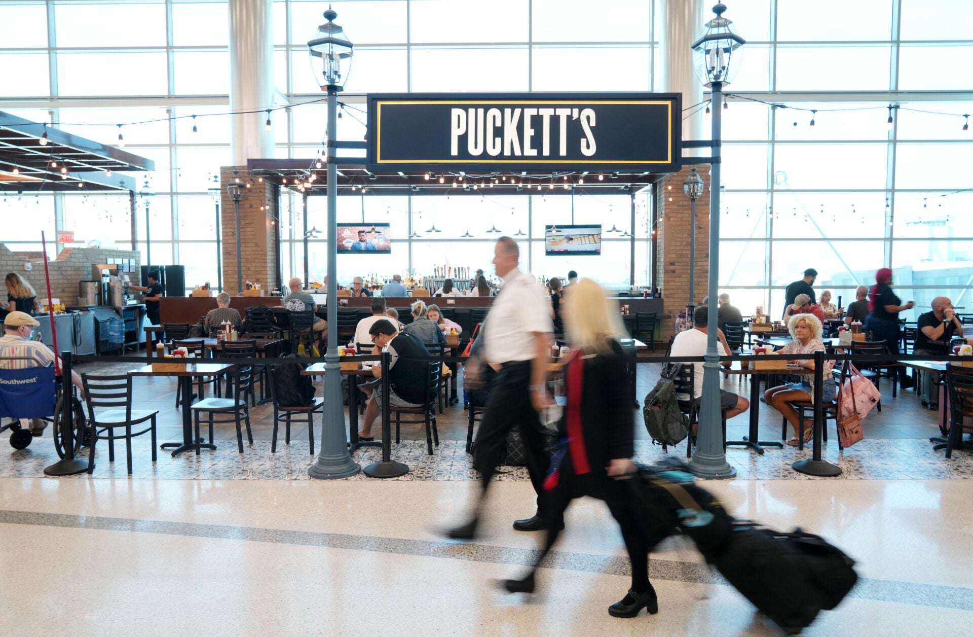 people walking through airport